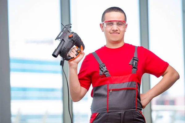 Young furniture carpenter in industrial concept — Stock Photo, Image