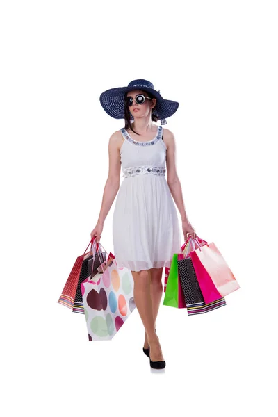Mujer joven con bolsas de compras de Navidad en blanco — Foto de Stock