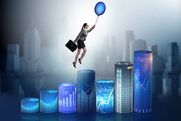 Businesswoman flying on hot balloon over graph — Stock Photo, Image