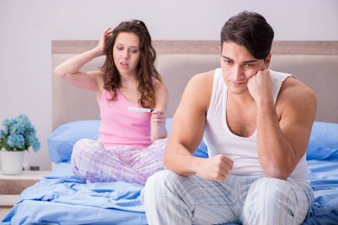 Man husband upset about pregnancy test results clipart