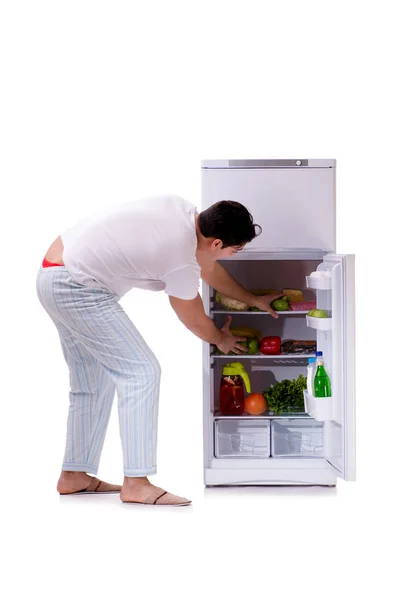 Man next to fridge full of food — Stock Photo, Image