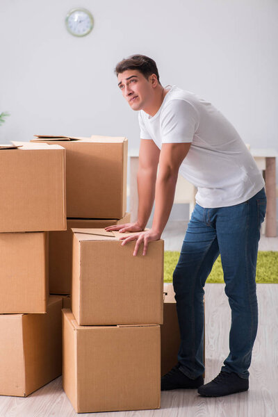 Man caryying boxes at home