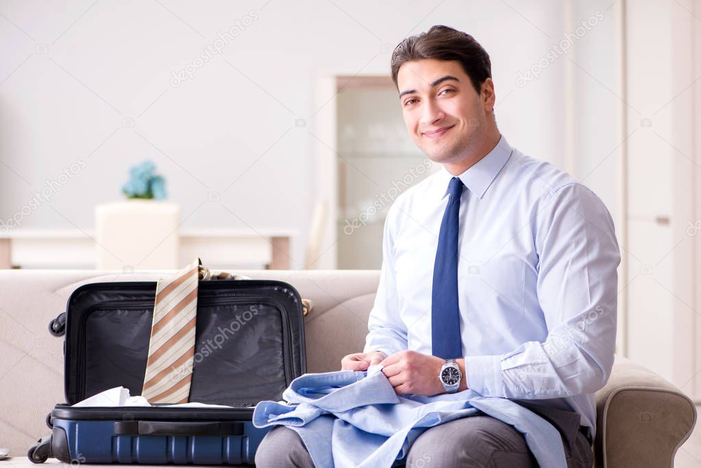 Businessman preparing for the business trip