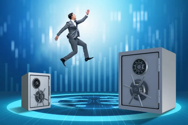 Businessman jumping from safes in business concept — Stock Photo, Image