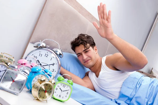 Man having trouble waking up in morning