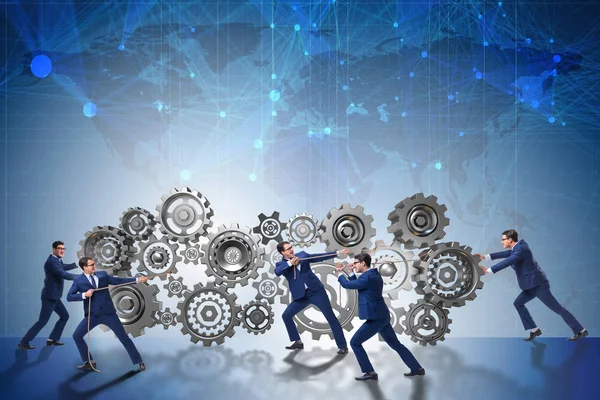 Businessman in teamwork concept with cogwheels — Stock Photo, Image