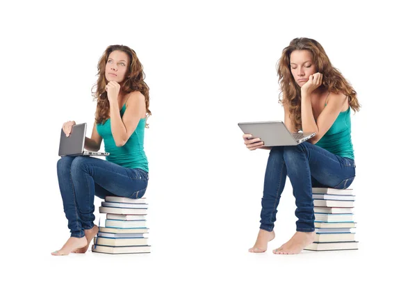 Student with netbook sitting on books — Stock Photo, Image