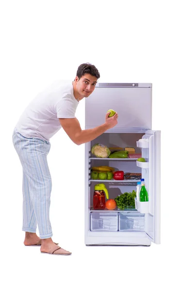 Man next to fridge full of food — Stock Photo, Image