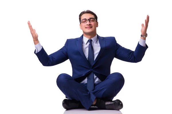 Geschäftsmann meditiert auf dem Boden isoliert auf Weiß — Stockfoto