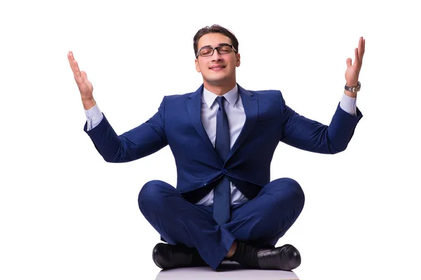 Businessman meditating on the floor isolated on white — Stock Photo, Image