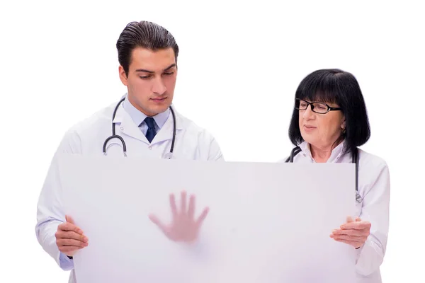 Két orvos elszigetelt fehér background — Stock Fotó