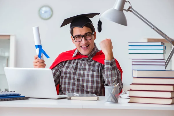 Super hero student with books studying for exams — Stock Photo, Image