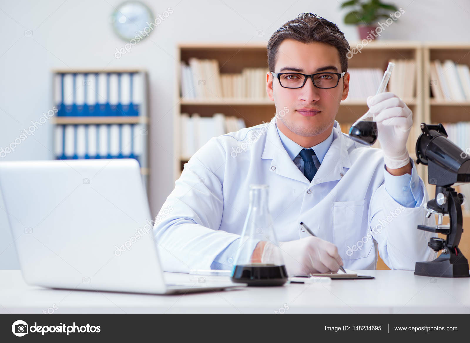 Chemical Engineer Working On Oil Samples In Lab Stock Photo