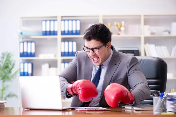 Angry aggressive businessman with boxing gloves — Stock Photo, Image