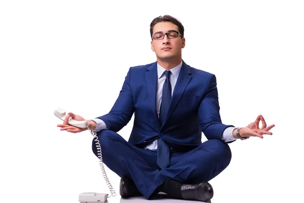Empresario meditando en el suelo aislado en blanco —  Fotos de Stock