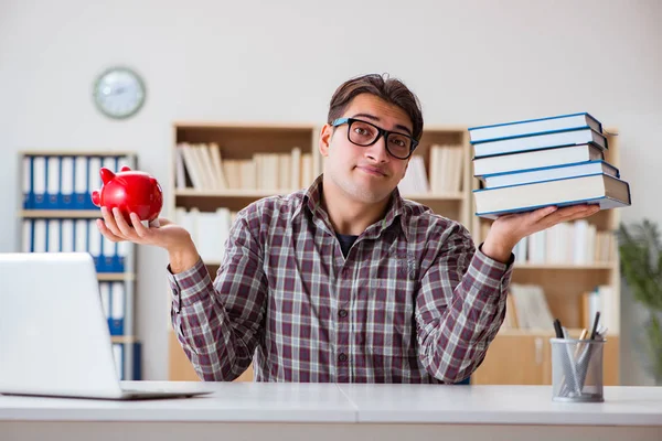 Student breaking piggybank to pay for tuition fees