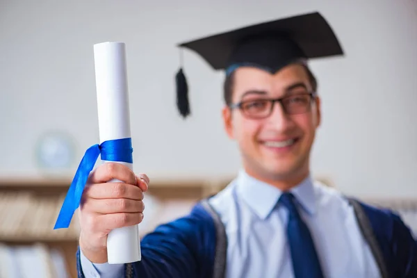 Young man graduating from university — Stock Photo, Image