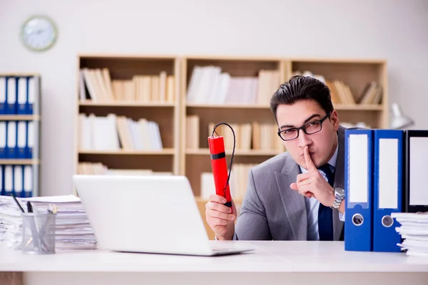 Businessman with dynamite in the office — Stock Photo, Image