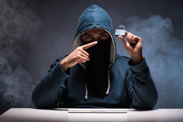 Computer hacker working in dark room — Stock Photo, Image