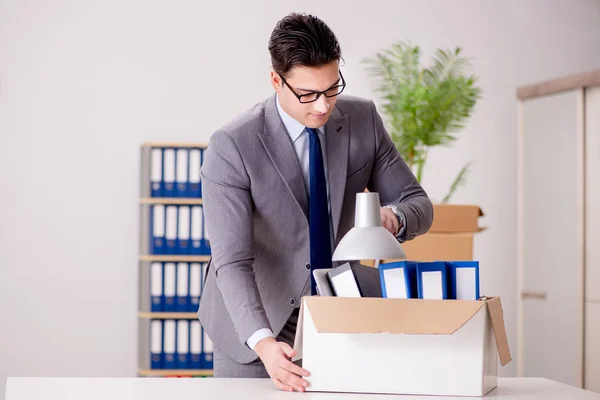 Businessman moving offices after promotion