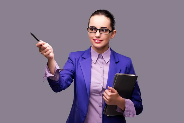 Businesswoman pressing virtual button with pen — Stock Photo, Image