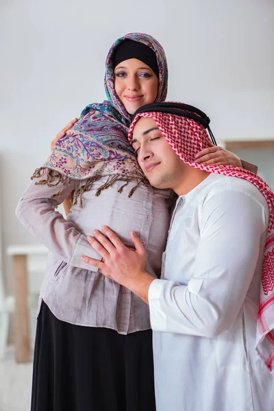 Young arab muslim family with pregnant wife expecting baby — Stock Photo, Image