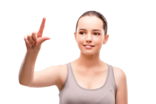 Молодая спортивная девушка нажимает виртуальную кнопку, изолированную на белом — стоковое фото