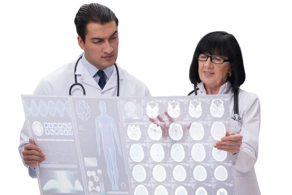 Two doctors looking at x-ray image isolated on white — Stock Photo, Image