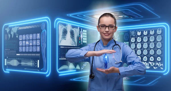 Woman doctor in futuristic medical concept — Stock Photo, Image