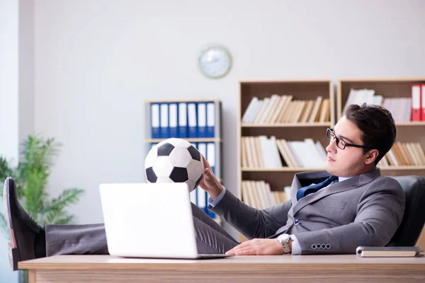 Businessman with football ball in office — Stock Photo, Image