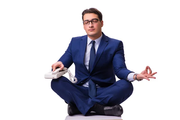 Empresario meditando en el suelo aislado en blanco — Foto de Stock