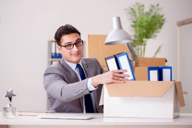 Businessman moving offices after promotion clipart