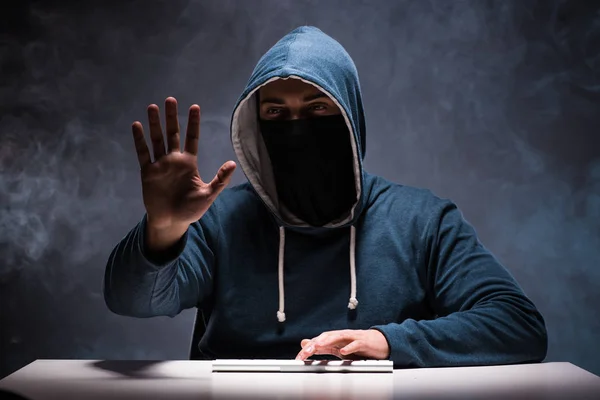 Computer hacker working in dark room — Stock Photo, Image