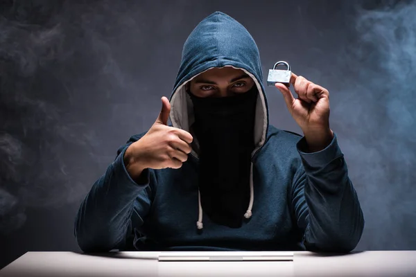 Computer hacker working in dark room — Stock Photo, Image