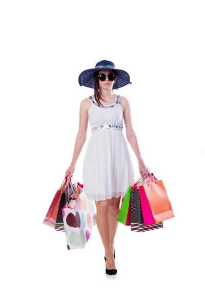 Young woman with christmas shopping bags on white — Stock Photo, Image