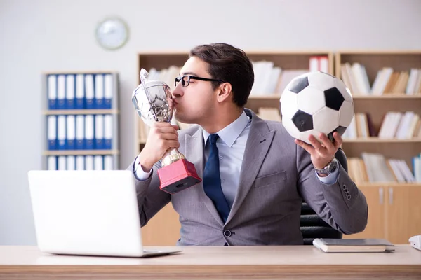 Businessman with football ball in office — Stock Photo, Image