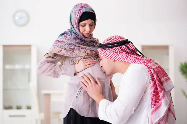Young arab muslim family with pregnant wife expecting baby — Stock Photo, Image