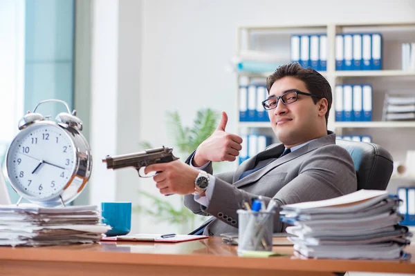 Young businessman in time management concept — Stock Photo, Image