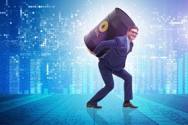 Petrol varili altında çalışan bir işadamı.