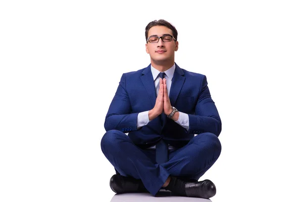 Geschäftsmann meditiert auf dem Boden isoliert auf Weiß — Stockfoto
