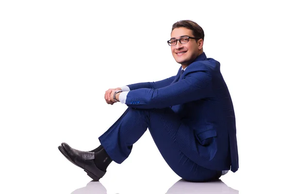 Бизнесмен, сидящий на полу изолированный на белом — стоковое фото
