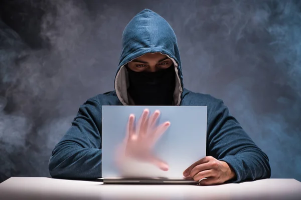 Computer hacker working in dark room — Stock Photo, Image