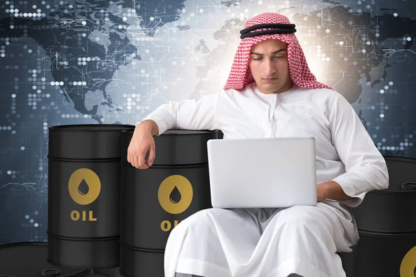 Arab businessman trading crude oil on laptop