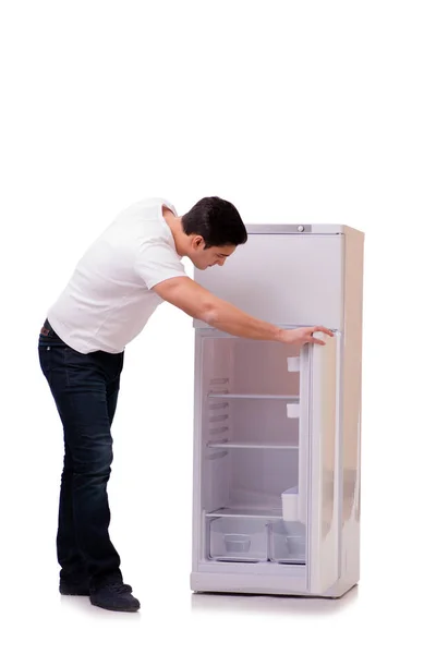 Uomo in cerca di cibo in frigorifero vuoto — Foto Stock