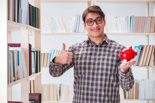 Junge Studentin in teurem Lehrbuchkonzept — Stockfoto