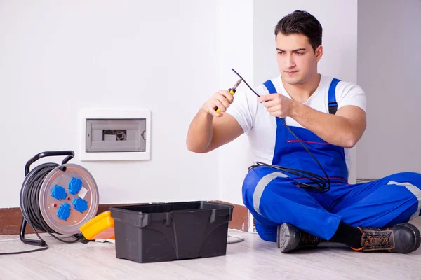 Man doing electrical repairs at home