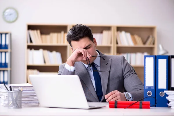 Businessman with dynamite in the office — Stock Photo, Image