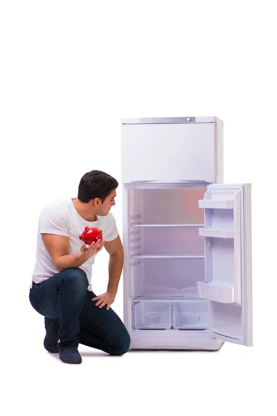 Hungry man looking for money to fill the fridge — Stock Photo, Image