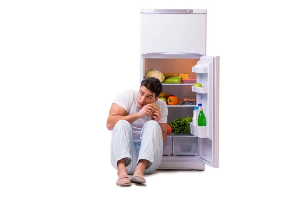 Man next to fridge full of food — Stock Photo, Image