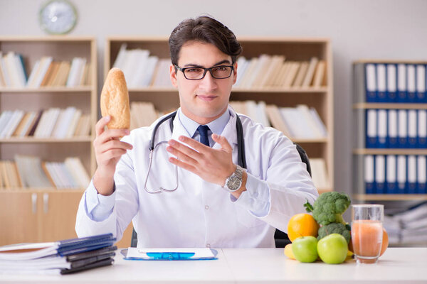 Doctor in dieting concept with fruits and vegetables